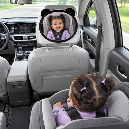 miroir voiture bébé africaine chandail mauve avec couette élastique mauve souriante
