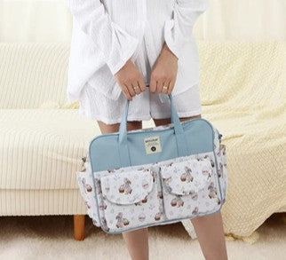 sac a langer à la main